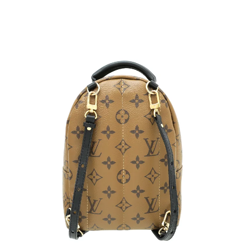 Louis Vuitton Twist bags with a snakeskin - effect panel for a bold lookLouis Vuitton Monogram Reverse Palm Spring Mini Backpack Bag