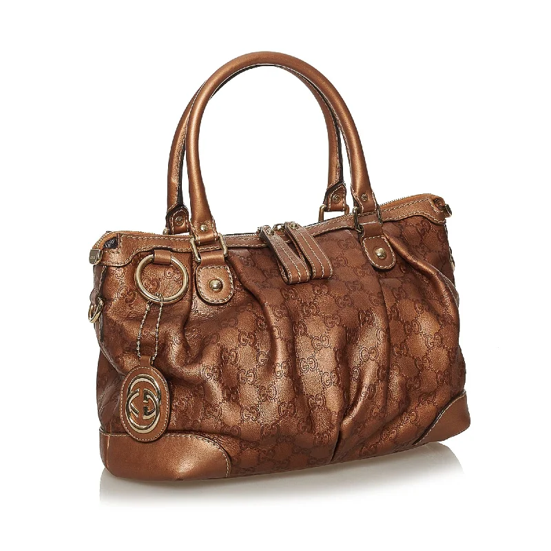 Women Gucci bags with a snap - button closure and a decorative charmGucci Guccissima Sukey Satchel (28360)